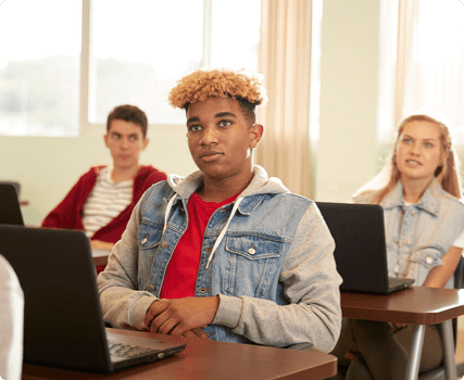 Photograph of a teacher talking to a classroom of high school students